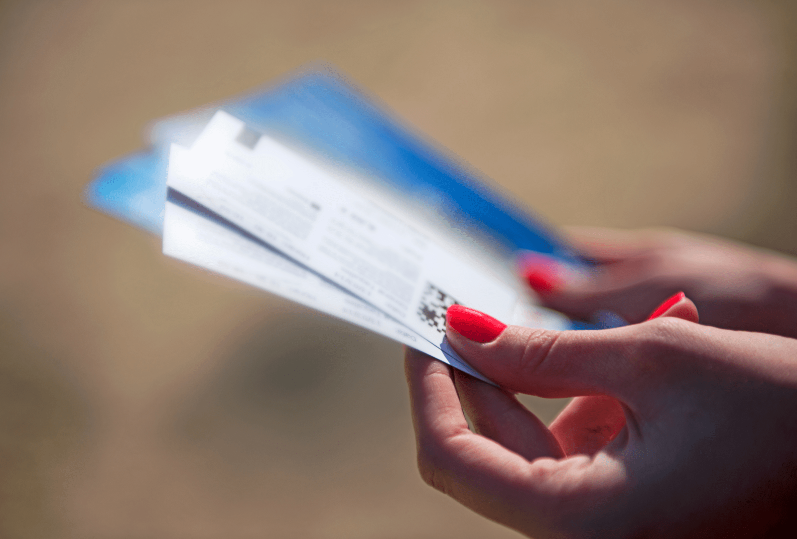 Woman holding tickets